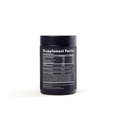 WelleCo The Super Elixir measuring scoop beside the container for precise daily servings.
