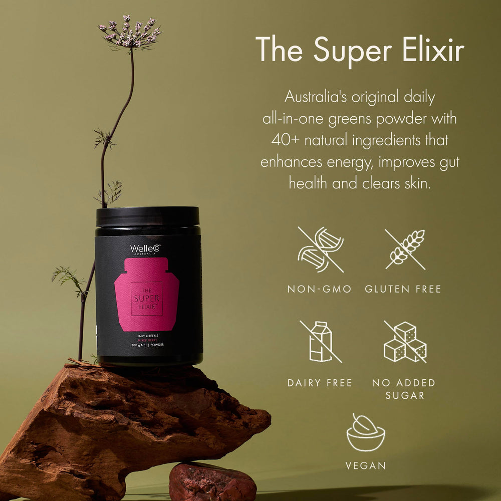 WelleCo The Super Elixir bottle beside a smoothie for easy mixing.