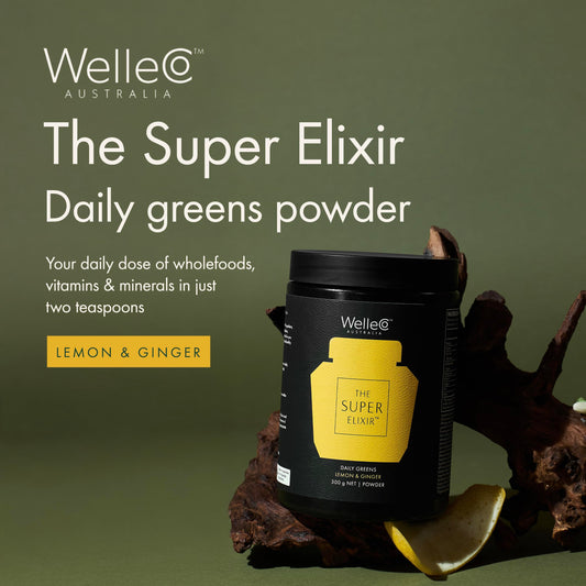 Spoon beside WelleCo tub, suggesting easy 2-teaspoon daily mix in your routine.