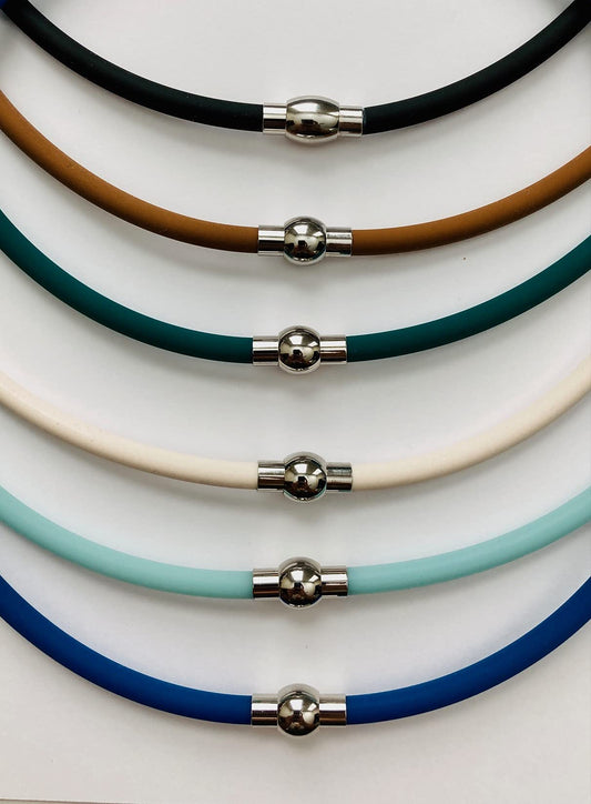 The Wellness Factor Biofield Vertigo Relief Necklace magnetic clasp closeup showing secure wear and energy flow.