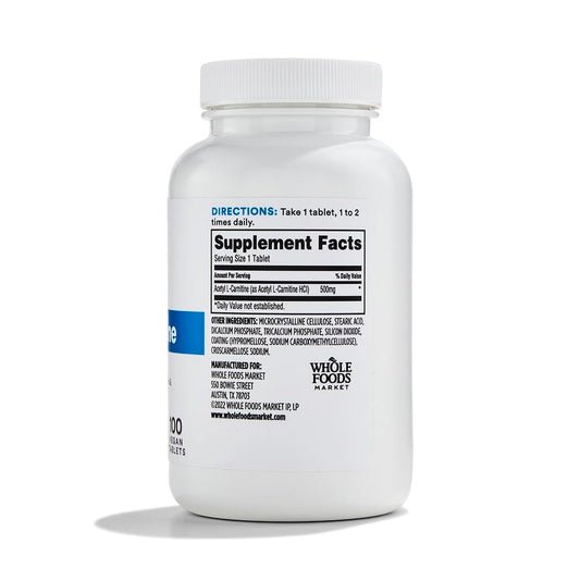 Acetyl L-Carnitine 500mg cap close-up on Whole Foods Market bottle for daily wellness.
