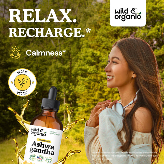 Wild and Organic Ashwagandha Drops dropper releasing drops into tea for easy use.