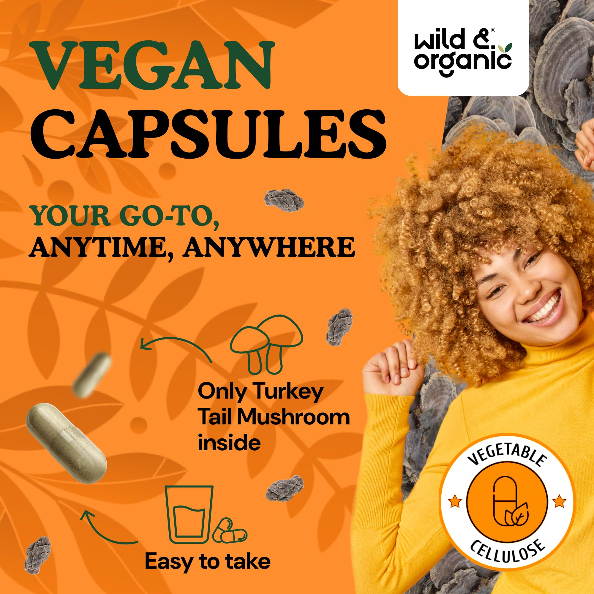 Wild & Organic turkey tail mushroom capsules closeup shows smooth coating for easy swallow.