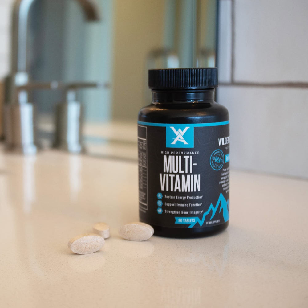 Wilderness Athlete bottle on desk for morning supplement routine.