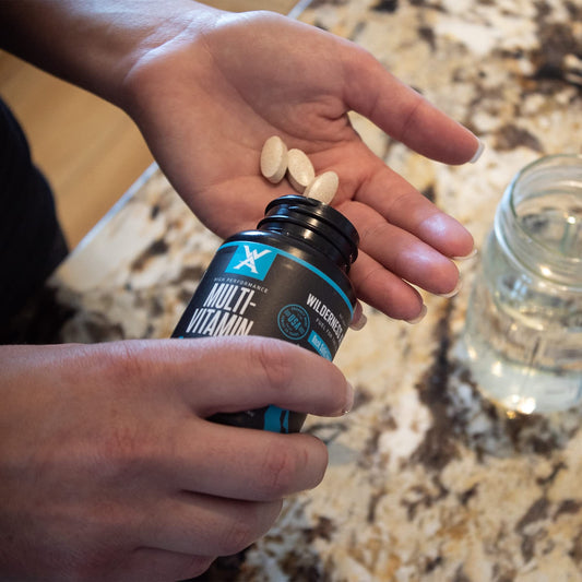 Wilderness Athlete daily multivitamin capsules ready for everyday energy and recovery.