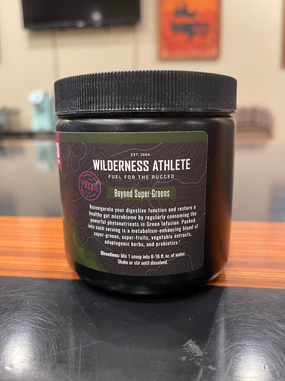 Wilderness Athlete Green Infusion label detail featuring ingredients and berry blend for overall wellness.