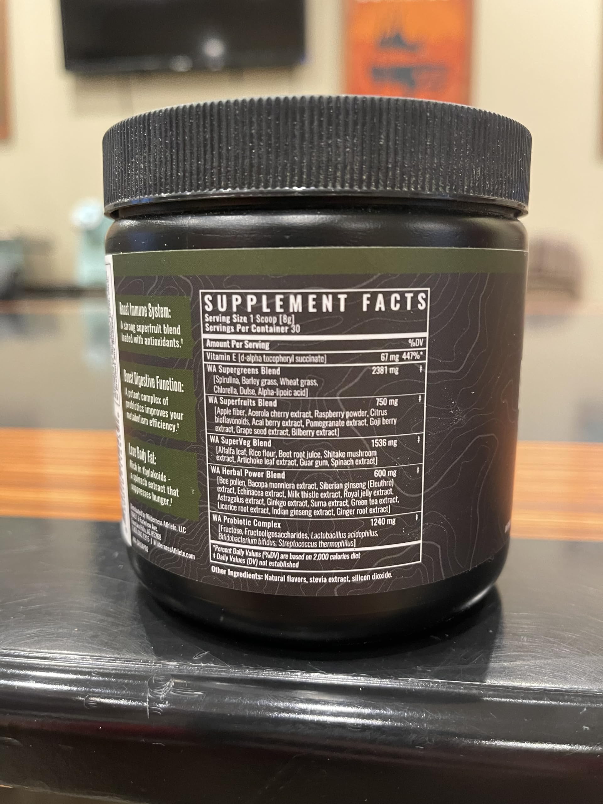 Wilderness Athlete Green Infusion shake served in a glass highlighting chocolate mint flavor.