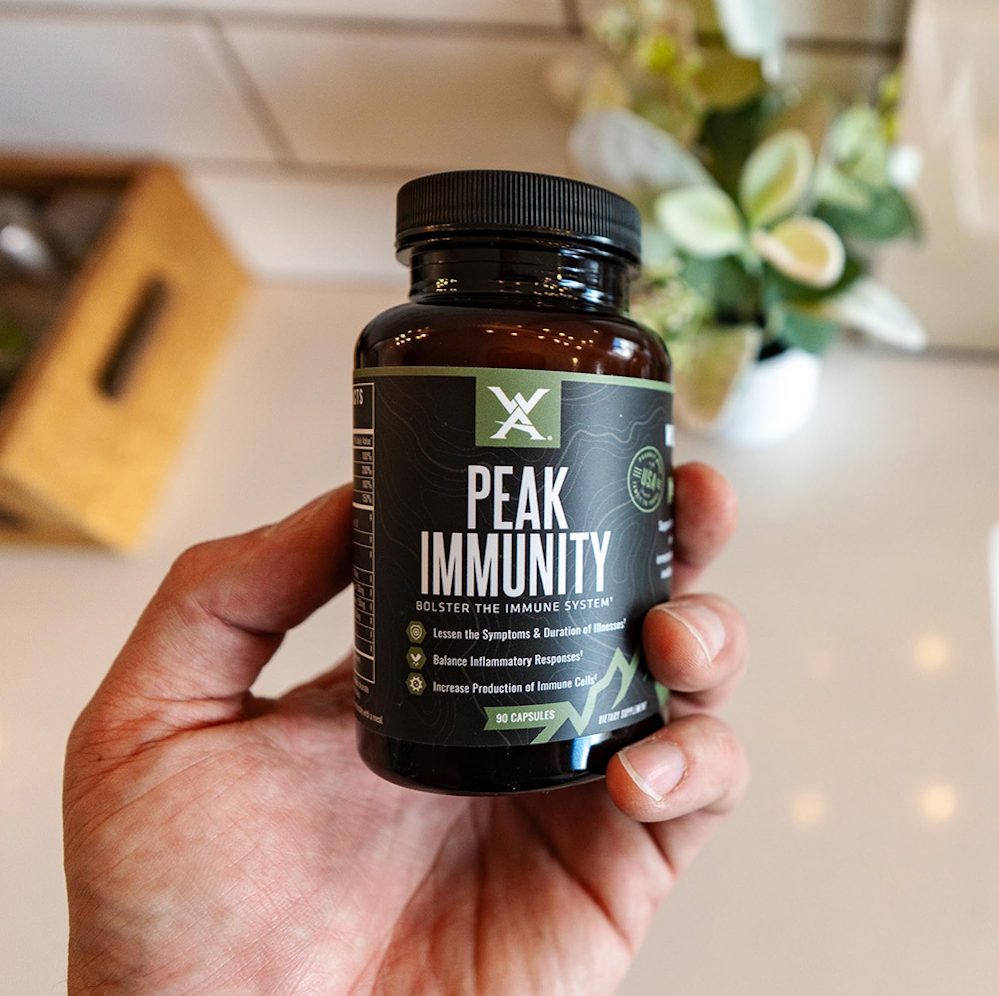 Wilderness Athlete Peak Immunity elderberry blend bottle promoting immune wellness.