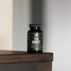 Wilderness Athlete Peak Immunity NAC capsules detail signaling immune support.