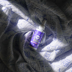 Wink Naturals WinkWell Kids Melatonin packaging on a nightstand
