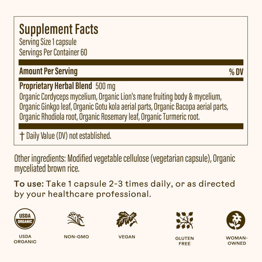 Wooden Spoon Brain Bloom capsules in hand, easy twice-daily support for attention.