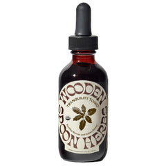Wooden Spoon Herbs Tranquility Tonic bottle showing organic six-herb blend for calm.
