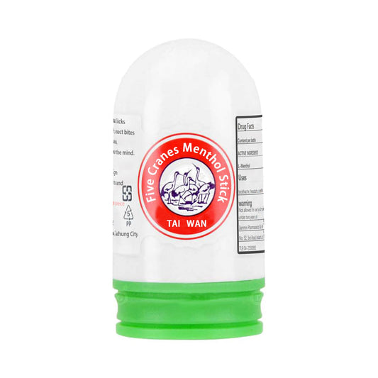 Close-up of Xinlong Five Cranes menthol stick showing compact menthol form for travel.