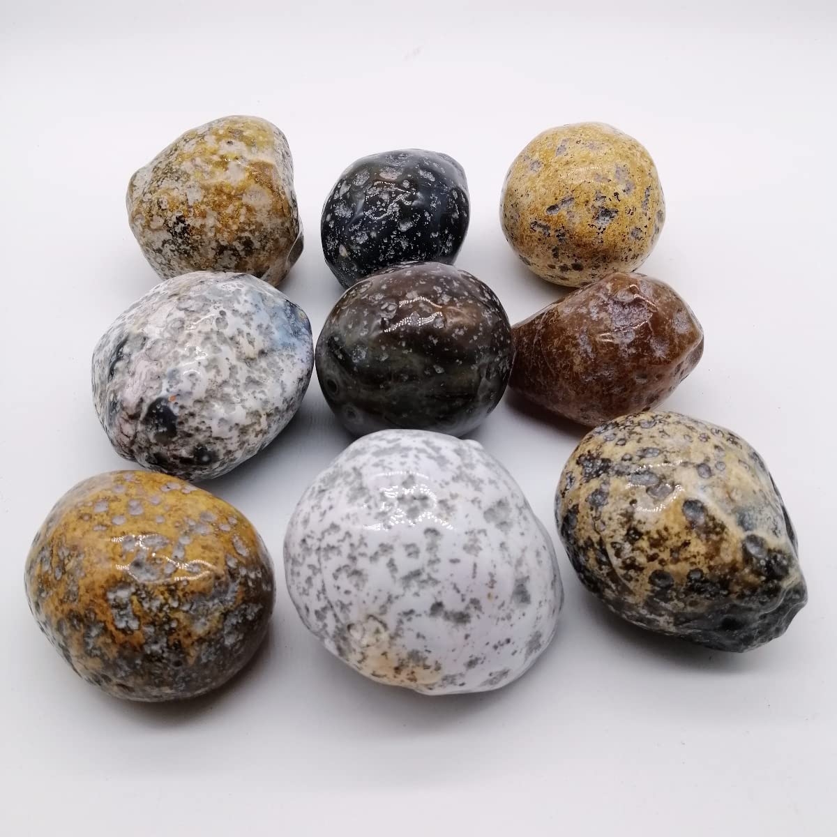 XMHOME agate rough ball in hand highlighting size and tactile feel for massage