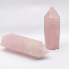 XMHOME rose quartz tower close-up facets reveal subtle ice cracks and translucence.