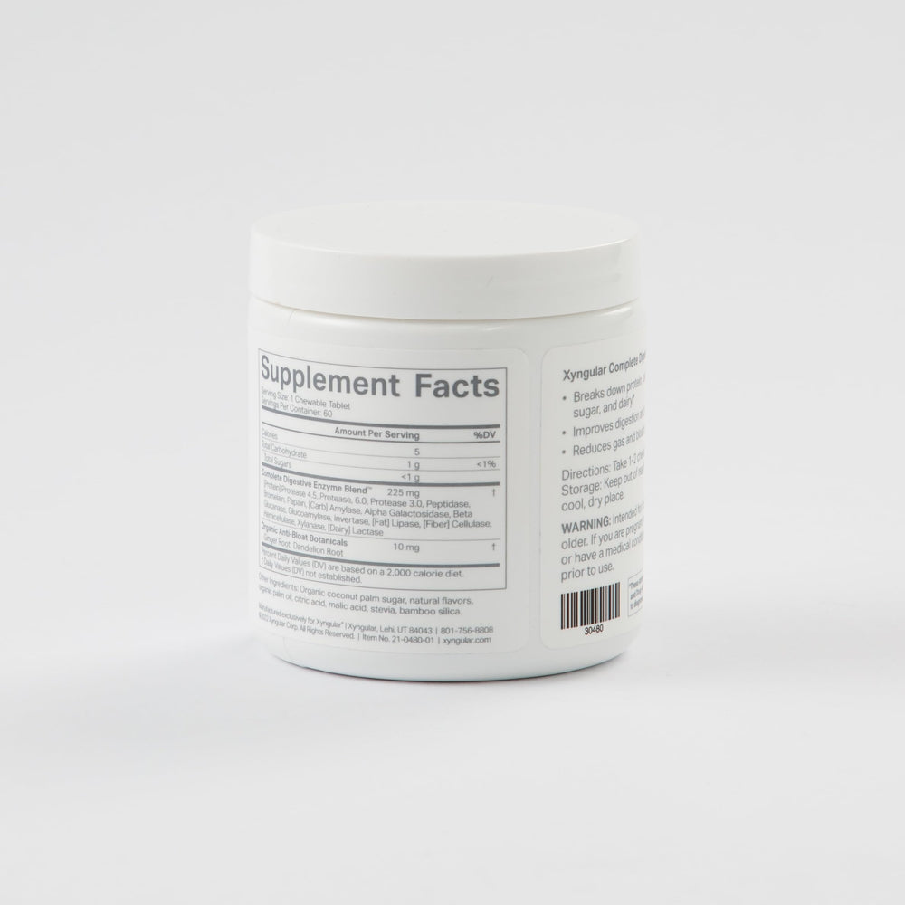 Xyngular Complete Digestive Aid bottle pour capturing a simple serving.