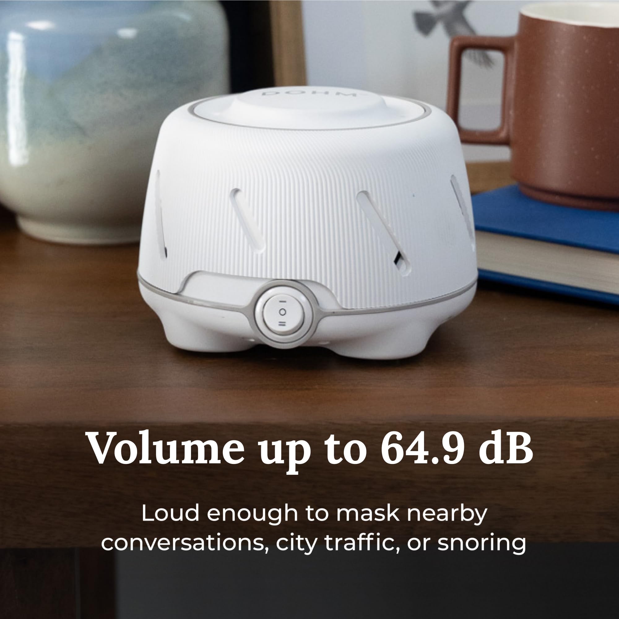 Yogasleep Dohm dial switch demonstrates adjustable tone for baby soothing and quiet nights.