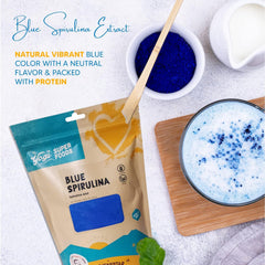Yogi Super Foods blue spirulina powder in a bowl boosts smoothie color.
