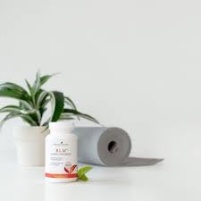 Young Living BLM capsules in a daily routine scene suggesting consistent use.