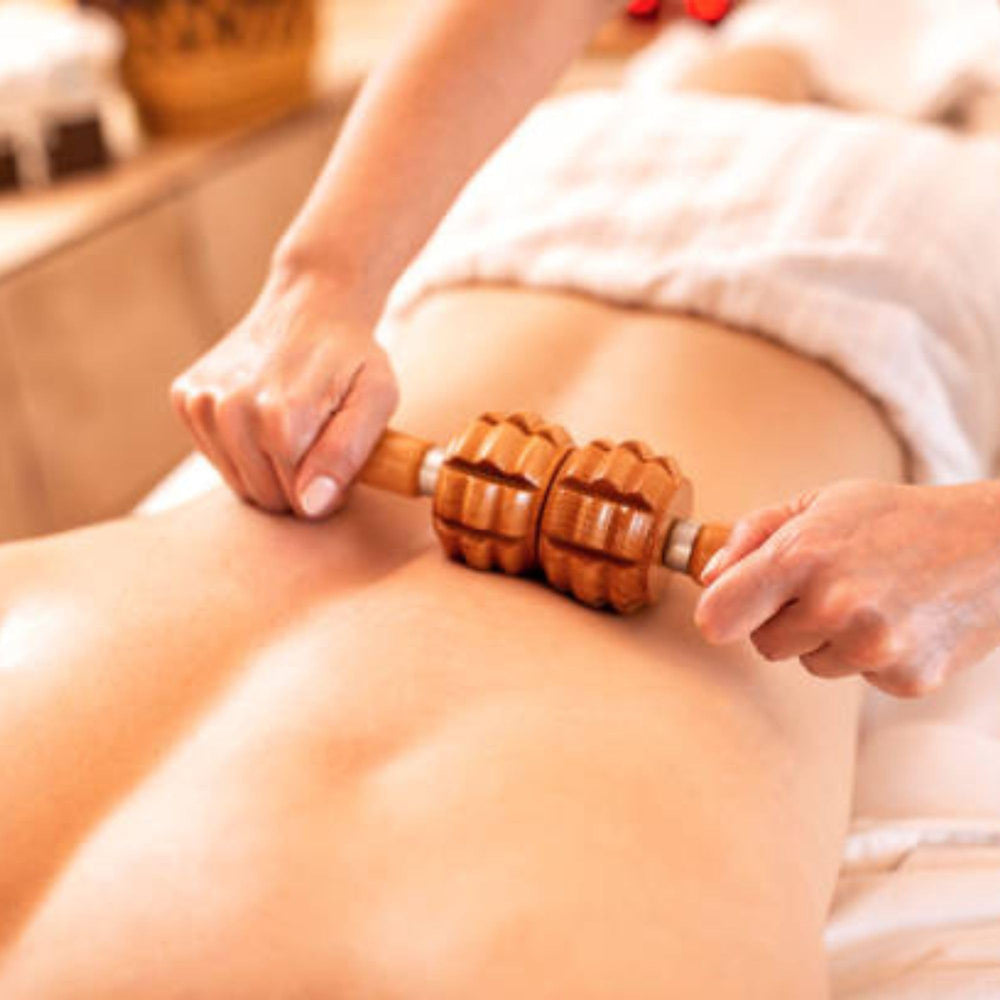 Cel-Lite Magic Massage Oil label closeup highlighting essential oils blend