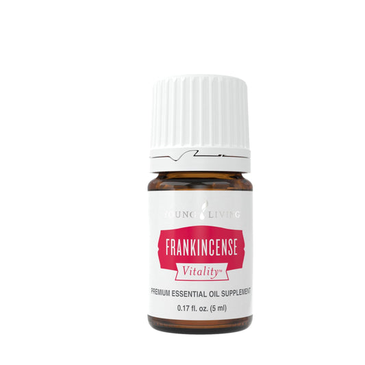Young Living Frankincense Vitality bottle pour – grounding aroma for calm, mindful moments.