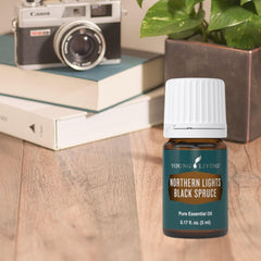 Young Living Northern Black Spruce diffuser setup promotes tranquil atmosphere.