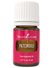 Young Living Patchouli essential oil bottle pour promotes grounding and calmness.