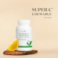 Closeup of Young Living Super C chewable tablets highlighting fruity citrus flavor.