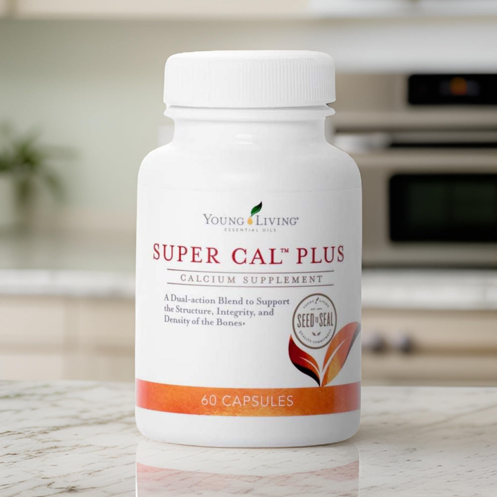Young Living Super Cal Plus bottle viewed from the side in a clean setting.