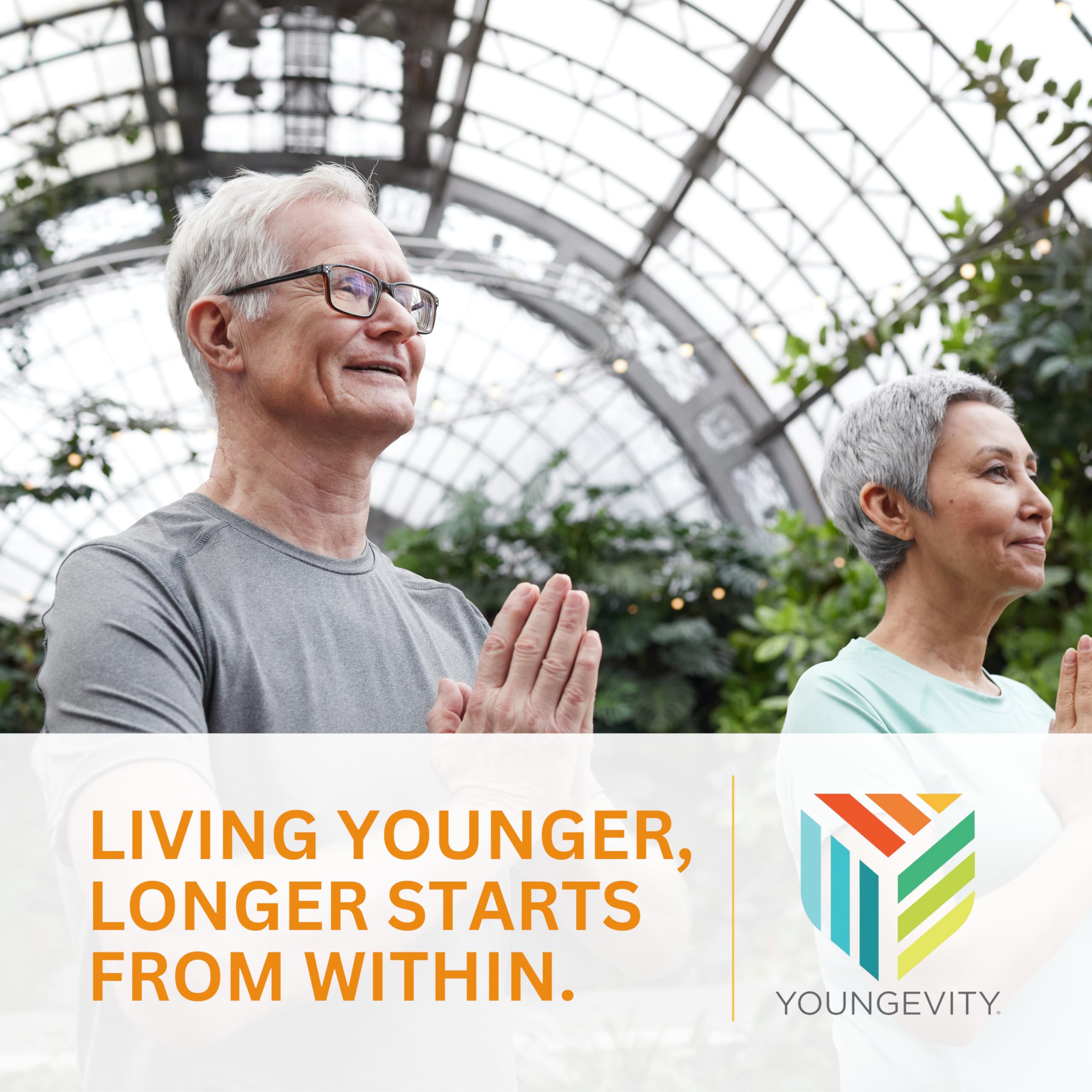 Youngevity Beyond Tangy Tangerine 2.0 in-use pouring into glass.