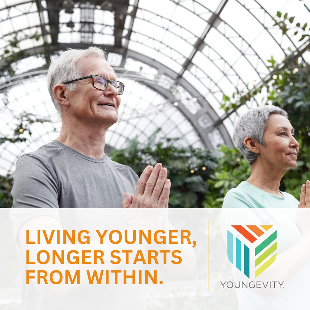Youngevity Beyond Tangy Tangerine 2.0 in-use pouring into glass.