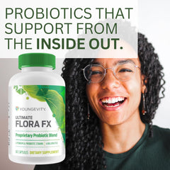 Youngevity Ultimate Flora FX capsules being poured into a hand.