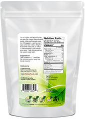 Z Natural Foods wheatgrass powder poured into a glass for a vibrant green juice