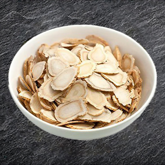 Zen Ginseng slices closeup with amber bottle for daily use