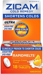 Zicam orange-cream rapidmelts bottle beside a glass of water