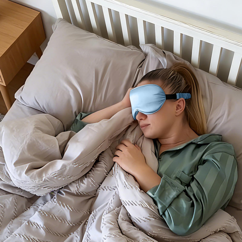 ZIMASILK sky-blue silk sleep mask with travel pouch for on-the-go use.