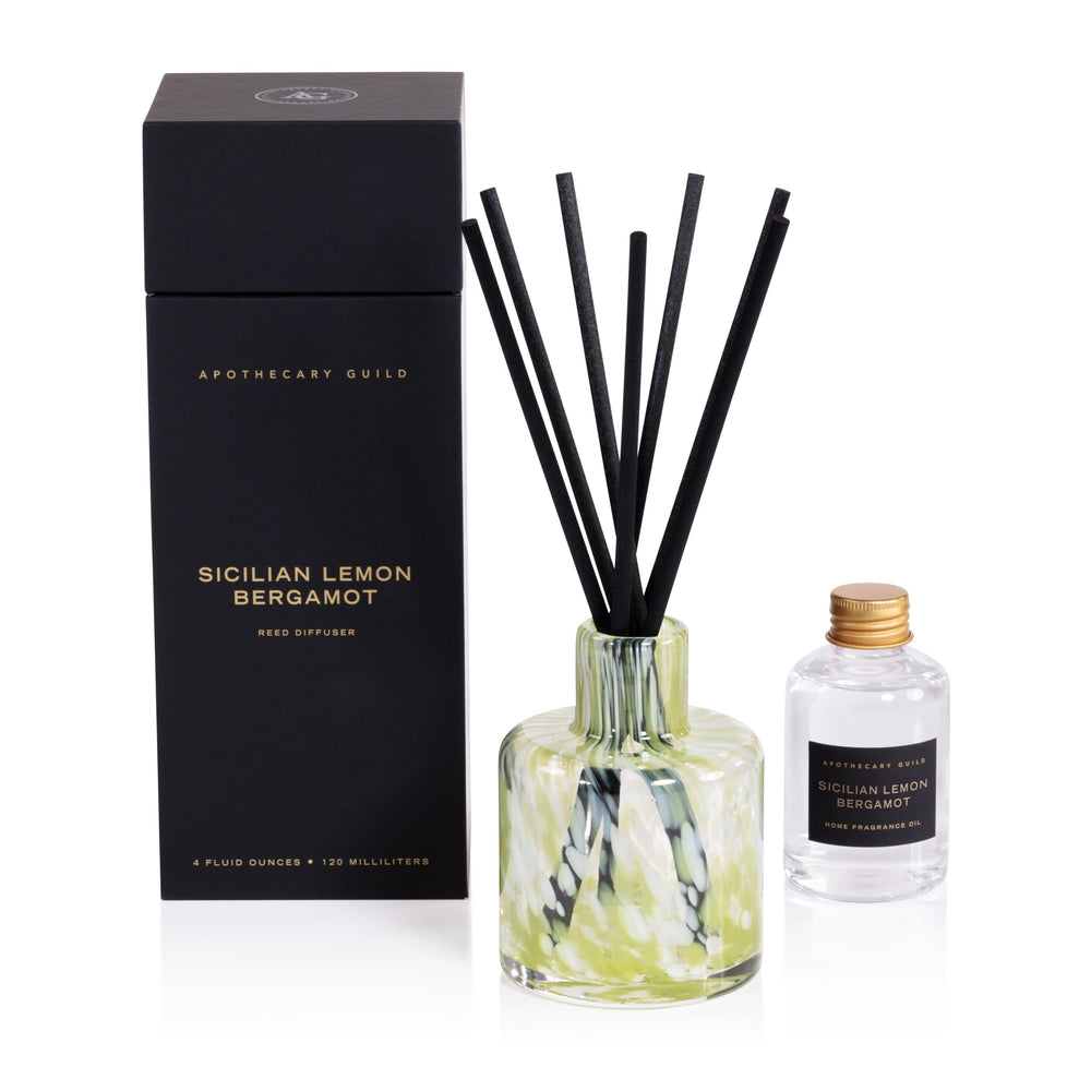 Zodax Apothecary Guild opal glass reed diffuser bottle inviting lasting fragrance in living spaces.